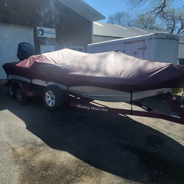Custom maroon boat cover on a trailered fishing boat