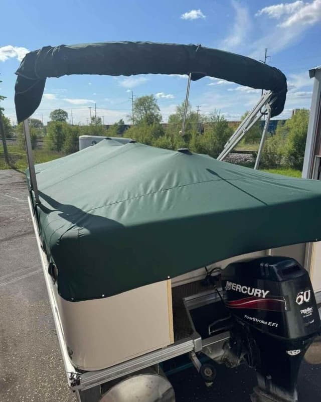 Custom green pontoon boat cover