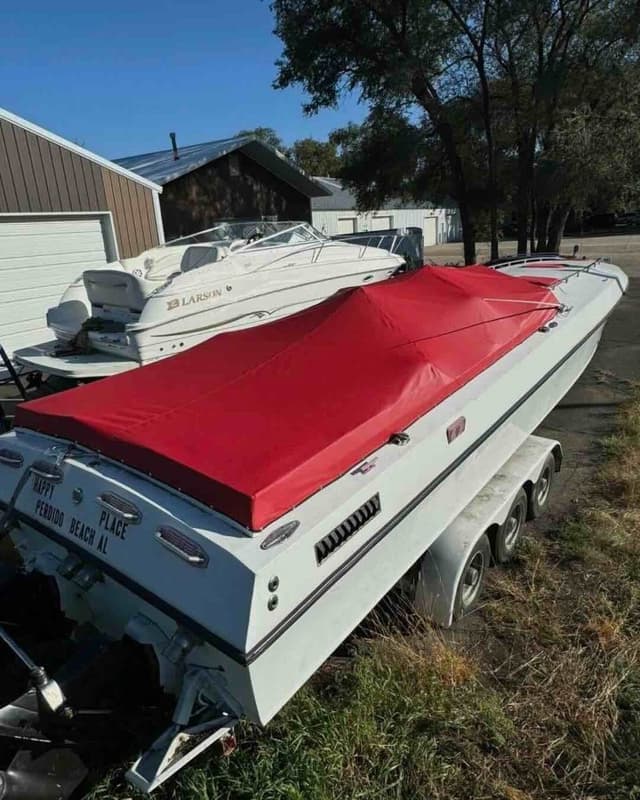 Custom red cuddy cabin boat cover